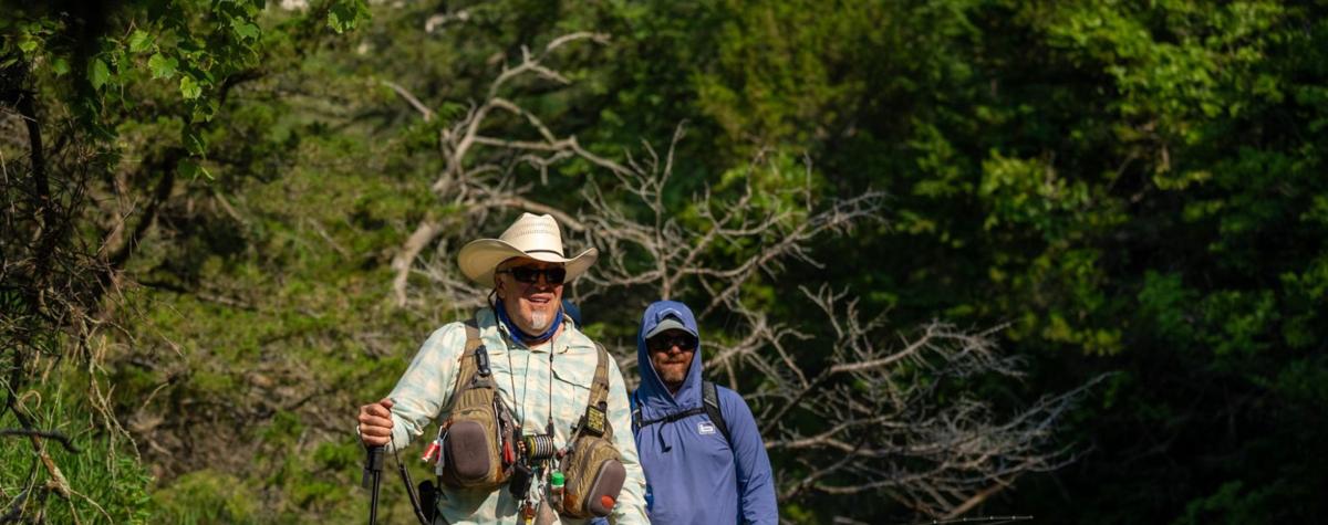Byron McFarland and John Bruckner fly fishing streamside