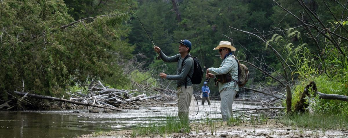 Connor Lacy, John Bruckner, and Byron McFarland fly fishing on the Snake River